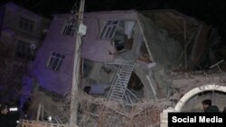 A collapse building in eastern Turkey is pictured on January 24 following a powerful earthquake.
