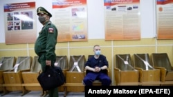 A Russian recruit waits for a medical checkup during spring conscription at a recruitment center in St. Petersburg.