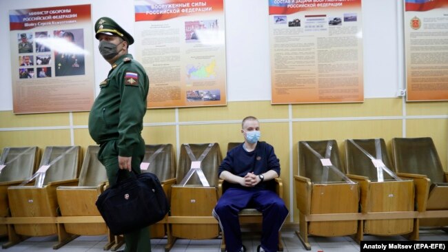 A Russian recruit waits for a medical checkup during spring conscription at a recruitment center in St. Petersburg.