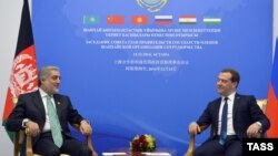 Russian Prime Minister Dmitry Medvedev and Afghan counterpart Abdullah Abdullah hold talks on the sidelines of a gathering of prime ministers of the Shanghai Cooperation Organization (SCO) in Astana on December 15.