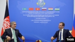 Russian former Prime Minister Dmitry Medvedev and Afghan counterpart Abdullah Abdullah hold talks on the sidelines of a gathering of prime ministers of the Shanghai Cooperation Organization (SCO) in Kazakhstan in 2014.