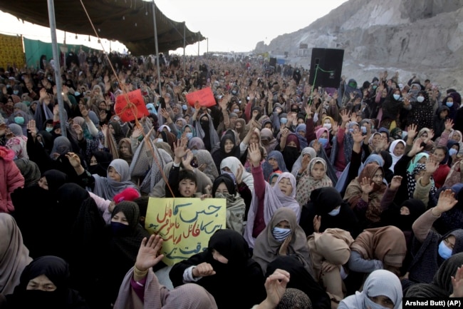 Members of the Shi'ite Hazara community chant slogans during a protest against the killing of a coal miner in Balochistan by IS-K in 2021.