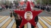 People carry a portrait of Soviet leader Josef Stalin during a march to celebrate the 72nd anniversary of the Soviet Union's victory over Nazi Germany in Sevastopol in Russian occupied Crimea on May 9, 2017,