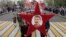 People carry a portrait of Soviet leader Josef Stalin during a march to celebrate the 72nd anniversary of the Soviet Union's victory over Nazi Germany in Sevastopol in Russian occupied Crimea on May 9, 2017,