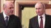 Mikhail Mishustin (solda) və Vladimir Putin