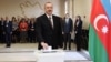 Azerbaijan's President Ilham Aliyev casts his vote in Baku.