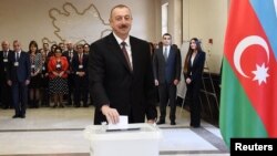 Azerbaijan's President Ilham Aliyev casts his vote in Baku.