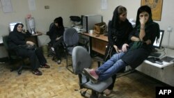 Journalists from Rouzegar, a reformist Tehran daily, sat in their editorial offices in September after receiving word of a two-month ban on their reporting.