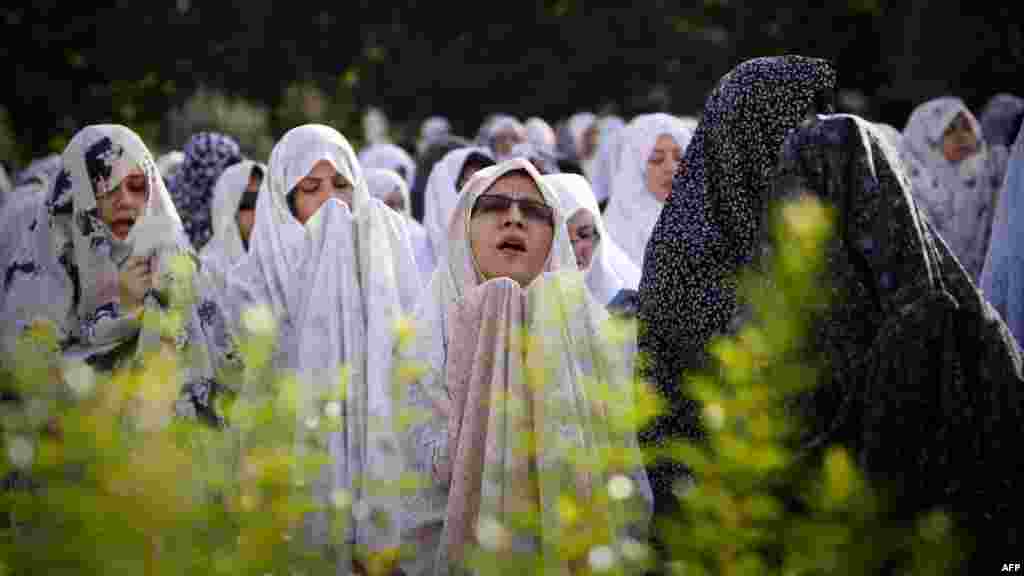 Women pray on the first day of Eid al-Fitr in western Tehran.