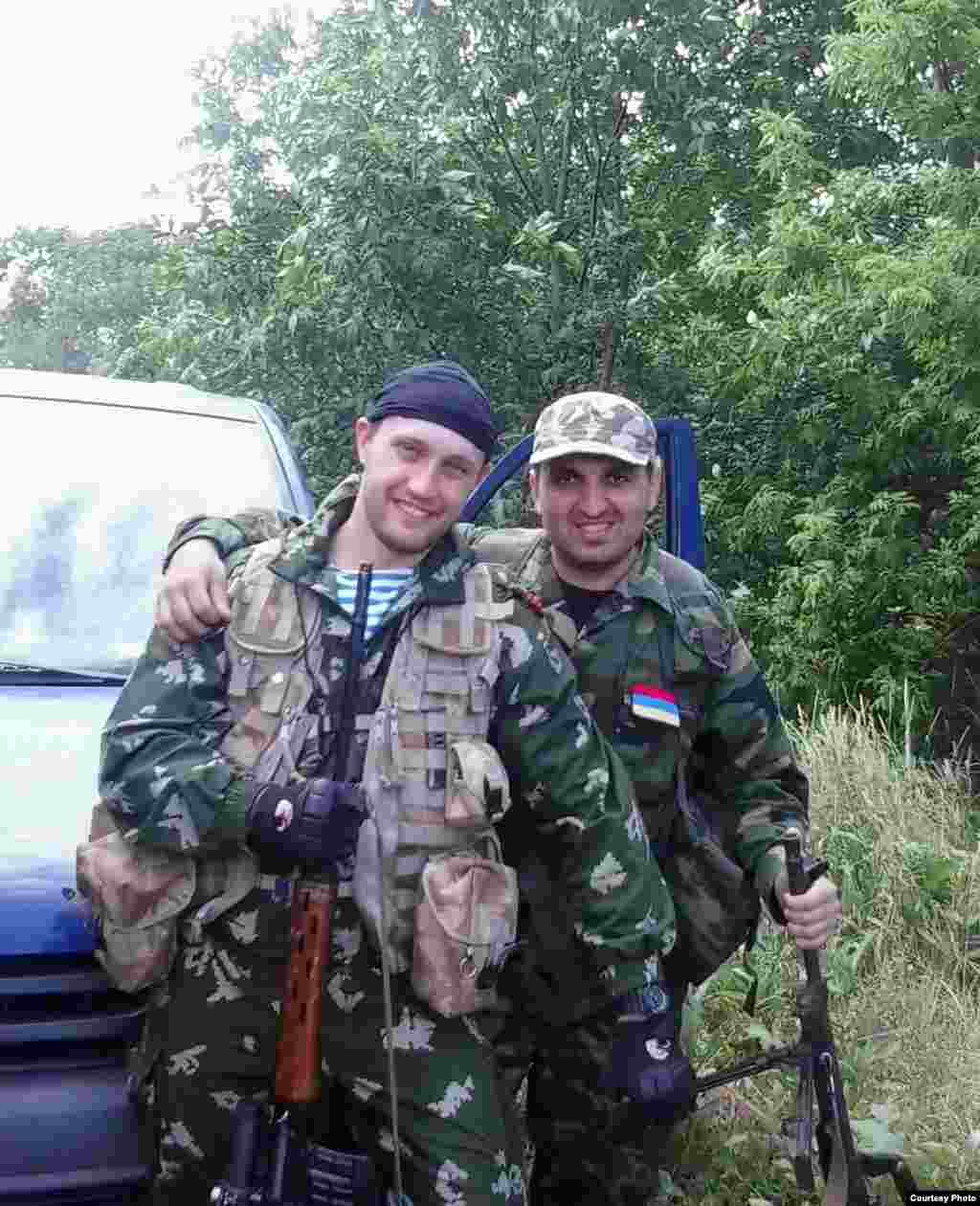 Artur Gasparyan (right) poses with a comrade from the Vostok Battalion.