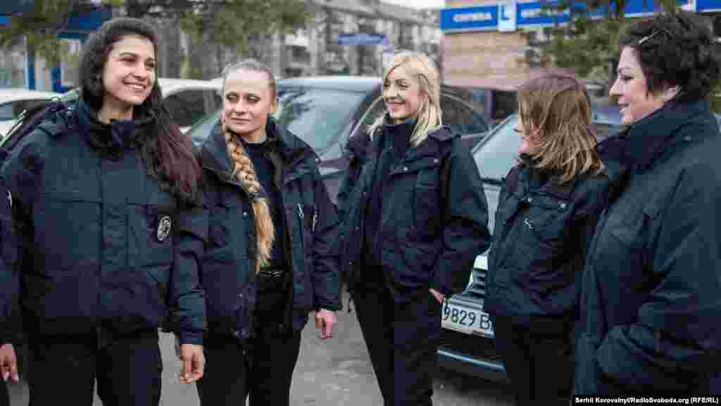 Ukrainian policewomen finish their night shifts early on March 8.