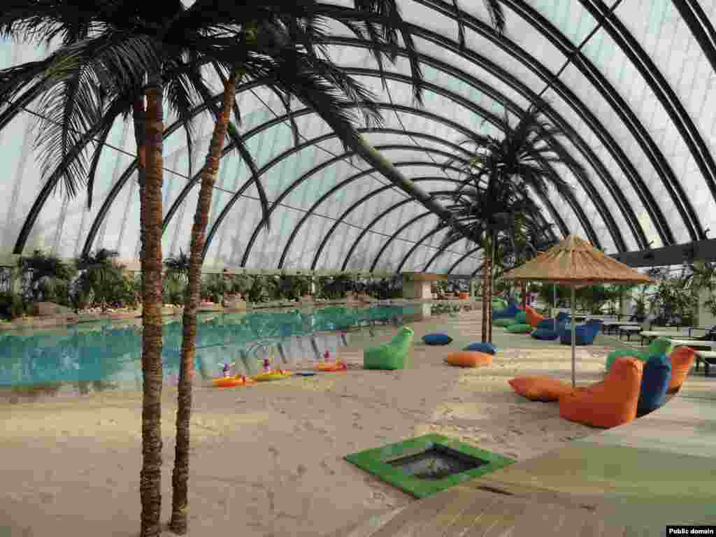 Inside the Khan Shatyr, an artificial beach stocked with sand from the Maldives awaits paying bathers. The extravagance of the new structures caused controversy in a country where the average annual household income around the time of Astana&rsquo;s construction was less than $600.