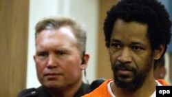 John Allen Muhammad (right) is led into a Manassas courtroom in February 2004.