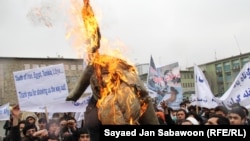Afghan protesters burn an effigy of U.S. President Barack Obama. With just three years before the West hands off full control of the country's security, questions remain over Afghanistan's political maturity.