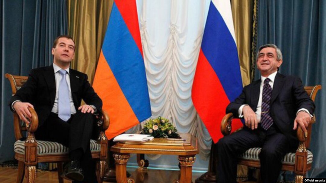 Russian President Dmitry Medvedev (left) meets his Armenian counterpart, Serzh Sarkisian, in St. Petersburg 