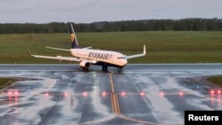 The Ryanair plane that had been carrying Raman Pratasevich finally lands in Vilnius on May 23 after being forcibly diverted to land in Minsk.