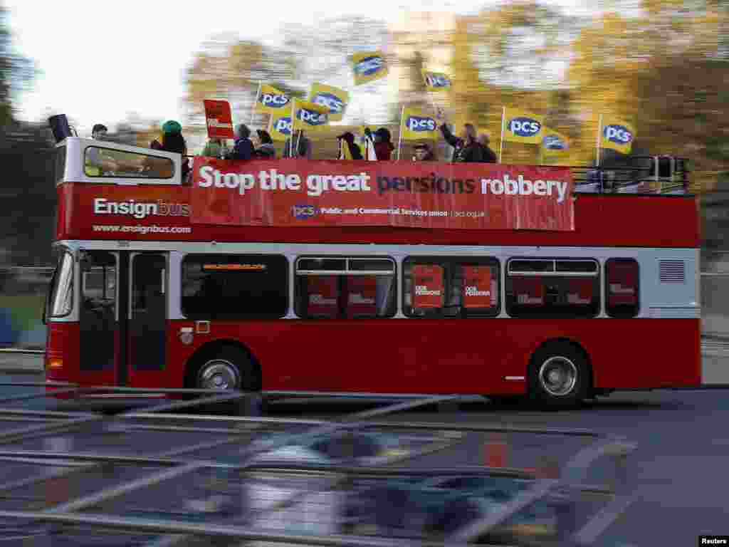 A bus carrying union members drives through Parliament Square in central London on November 30 during that country&#39;s first mass strike in some 30 years. (REUTERS/Stefan Wermuth)