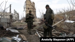 Ukrainian soldiers patrol the front line near Avdiyivka in the Donetsk region.