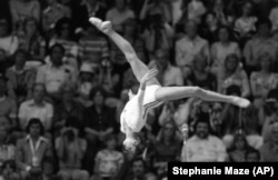 Nadia Comaneci performs a flip on the balance beam on her way to a gold medal at the Montreal Olympics.