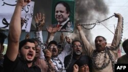 Supporters of Pakistan Muslim League-Nawaz (PML-N) chants slogans after the sentencing decision against former prime minister Nawaz Sharif, during a protest in Multan on July 7.