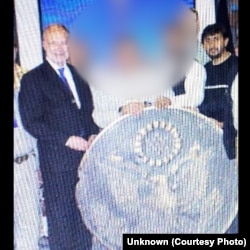 Mohammad Masood Jamshidi, right, during his service at the US consulate in Herat. Also pictured is the then US ambassador, James Cunningham.
