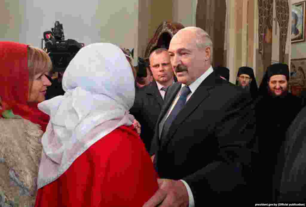 Belarusian&nbsp;President Alyaksandr Lukashenka and his younger son, Nikolai, visit a church during Orthodox Easter on April 19. Lukashenka has derided global concerns over COVID-19 as &quot;mass psychosis&quot; and said that there was no need for strict measures to slow the spread of the virus.