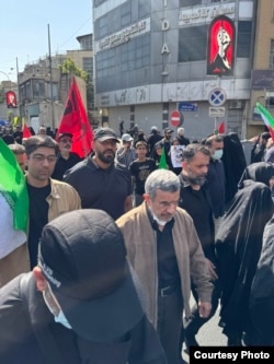 Former Iranian President Mahmud Ahmadinejad (center) attends a funeral procession for Supreme Leader Ayatollah Ali Khamenei on July 6.