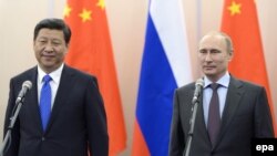 Россия Президенти В.Путин (ў) ва Хитой Президенти С.Цзиньпин, 2014 йил 6 февраль, Сочи.