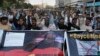 Angry protester chant slogans during a demonstration against independent Pakistani newspaper Dawn outside the Press Club in Karachi on December 3.