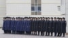 FILE: Kazakhstan's railway staff line up to welcome foreign diplomats at a border crossing with China.