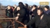 Screen grab for this video https://www.rferl.org/a/georgia-abkhazia-bridge-mourners/29785244.html