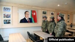 Azerbaijan - Defense Minister Zakir Hasanov (C) visits an Azerbaijani army base.