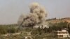 Smoke billows following a reported Russian air strike in the mostly rebel-held Syrian province of Idlib on September 20. 