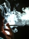 World -- A woman smokes a cigarette - generic