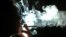 World -- A woman smokes a cigarette - generic