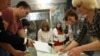 Members of a local election commission count ballots at a polling station following municipal elections in Ryzazan on September 10.