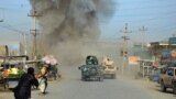 FILE: Smoke billows from the scene of a suicide bomb blast that targeted a police headquarters in Kunduz, February, 2015.