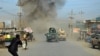 Smoke billows from the scene of a suicide bomb attack in the northern Afghan province of Kunduz on February 10.