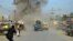 Smoke billows from the scene of a suicide bomb attack in the northern Afghan province of Kunduz on February 10.