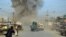 Smoke billows from the scene of a suicide bomb blast in Kunduz in February.