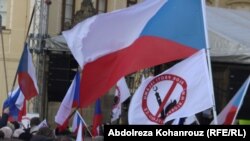 Several hundred people hold banners and Czech flags during an anti-immigrants rally, Prague on February 6.