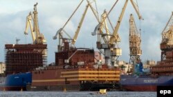 Greenpeace activists in a boat display a banner reading "No to floating Chernobyl" in front of the floating nuclear power plant Academician Lomonosov in St. Petersburg last year.