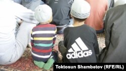 Kyrgyzstan -- Children in mosque, Chaek village, Naryn region, undaed