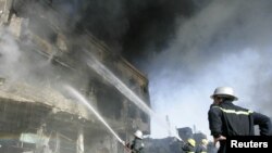 Firefighters battle a blaze after a bomb attack in Kirkuk.