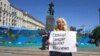 Darya Polyudova protests in Moscow to demand the release of Ukrainian political prisoners from Russian prisons in May 2018.