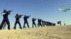 Syria -- An image grab taken from a propaganda video uploaded on September 7, 2013 by Syria's Islamist Ahrar al-Sham group shows its members taking part in a training session at an undisclosed location in Syria