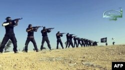 Syria -- An image grab taken from a propaganda video uploaded on September 7, 2013 by Syria's Islamist Ahrar al-Sham group shows its members taking part in a training session at an undisclosed location in Syria