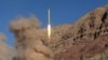 A long-range ballistic missile is launched in the Alborz mountain range in northern Iran, March 9, 2016