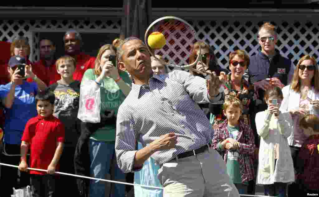 U.S. President Barack Obama jokes around during the 135th annual Easter Egg Roll on the South Lawn of the White House in Washington. (Reuters/Jason Reed)