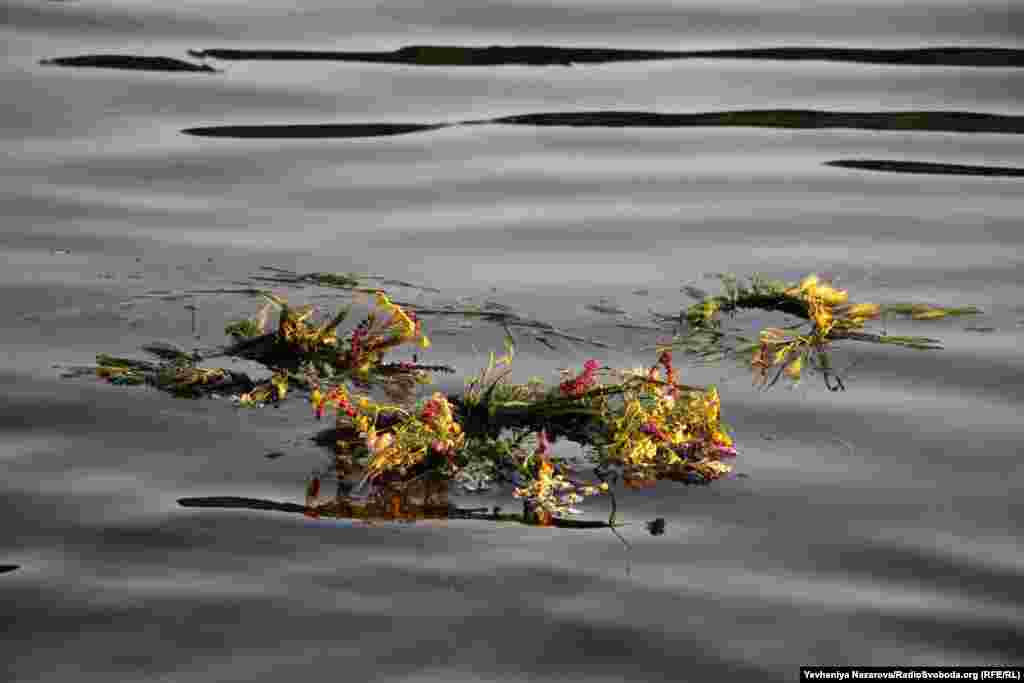 A wreath floats on the Dnieper River. Young women place wreaths on the water for divination: the direction they float is said to show where each woman&#39;s future husband lives.&nbsp;